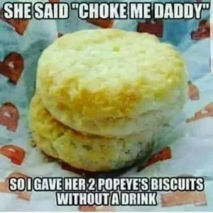 Two Popeyes biscuits on a paper towel with the caption, "She said: choke me daddy," and gave her 2 Popeyes biscuits without a drink, referencing the choking meme.